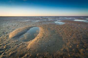 Sonnenaufgang am Watt an der Nordsee