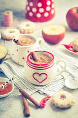 Winter hot drink. Hot chocolate or cocoa with spices, cookies and fresh apple