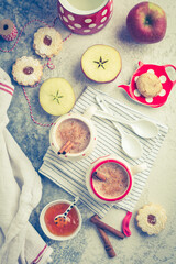 Winter hot drink. Hot chocolate or cocoa with spices, cookies and fresh apple