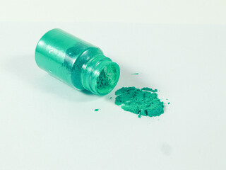 Green mica powder on white isolated background