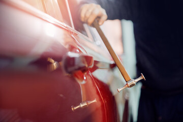 Car body repair, removal of dents paintless with knock tool