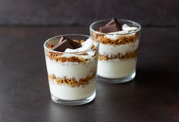 Granola with yogurt, coconut and chocolate. Muesli. Breakfast. Vegetarian food. Healthy eating.