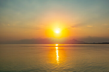 Obraz premium Antalya harbor over sunset sky and high mountains. Beautiful view of the Antalya Kaleiçi Old town (Kaleici)