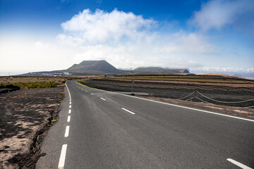 Long empty asphalt road on lanzarote, Canary Islands, Spain