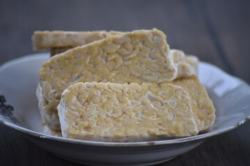 Tempeh or tempe is a traditional Javanese food made from fermented soybeans and made by a natural...