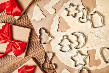 Making gingerbread Christmas Cookies Using form for cooking on wooden background