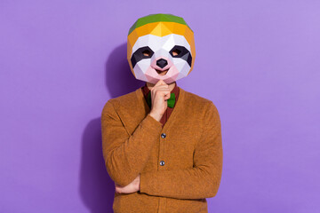 Photo of young man arm touch chin thinking intelligent brainstorming red panda isolated over purple color background © deagreez