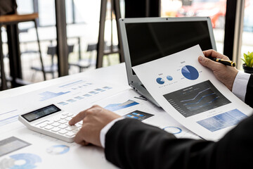 Business men are looking at the company's financial documents to analyze problems and find solutions before bringing the information to a meeting with a partner. Financial concept.