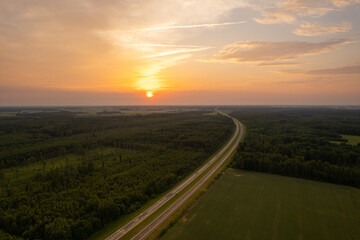 Aerial summer evening stormy view of highway road, before the storm