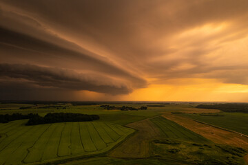 Aerial summer evening stormy view of fields before the storm