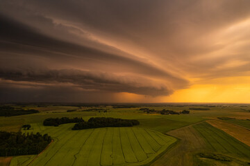 Aerial summer evening stormy view of fields before the storm