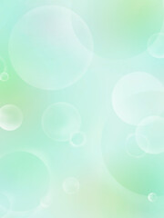 黄緑色の背景に浮かぶしゃぼん玉（タテ）