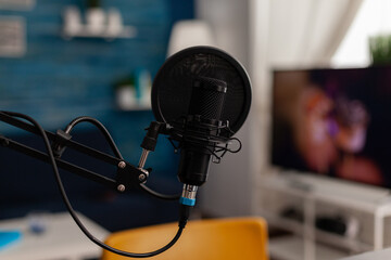 Closeup of recording microphone in home studio. Professional live broadcast equipment to record...
