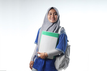 portrait of an Asian woman wearing work or school clothes. veiled women carry report books and backpacks. learning or working photo concepts with happy expressions
