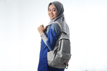 portrait of an Asian woman wearing work or school clothes. hooded women carry a casual backpack. learning or working photo concepts with happy expressions
