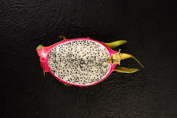 Ripe dragon fruit on black background