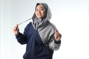 portrait of an Asian woman wearing casual clothes. hooded woman wearing gray jacket isolated on white background. beautiful woman with a happy expression