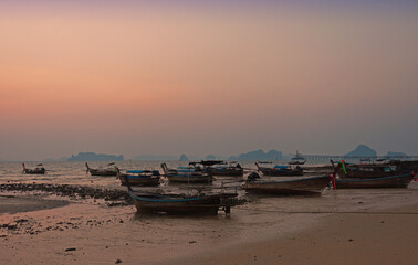 Fototapeta na wymiar On the shores of the sea at twilight in Krabi, Thailand