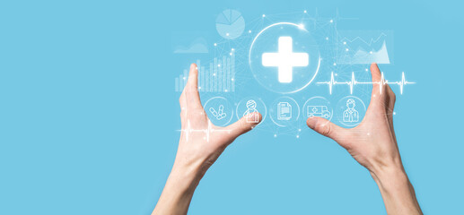 Businessman hold virtual plus medical network connection icons. Covid-19 pandemic develop people awareness and spread attention on their healthcare.Doctor,document,medicine,ambulance,patient icon.