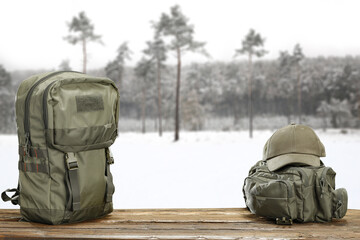 Desk of free space and backpack . Winter landscape of free space for your decoration. 
