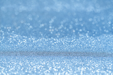 Obraz premium Blue glitter Christmas abstract background, with copy space for text.
