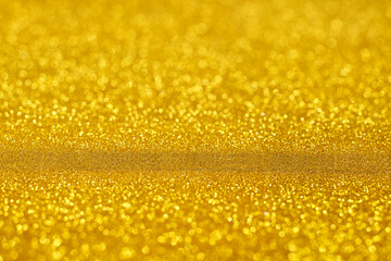 Gold glitter Christmas abstract background, with copy space for text.