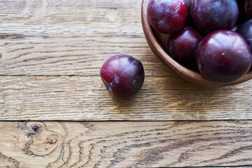plums fruits natural products on a wooden table top view