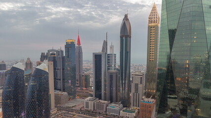Financial center of Dubai city with luxury skyscrapers day to night timelapse, Dubai, United Arab Emirates