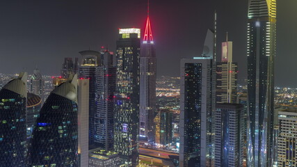 Fototapeta na wymiar Financial center of Dubai city with luxury skyscrapers night timelapse, Dubai, United Arab Emirates