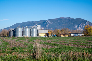 Fototapeta na wymiar landscape with animal feed silos