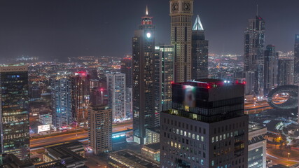 Skyscrapers on Sheikh Zayed Road and DIFC night timelapse in Dubai, UAE.
