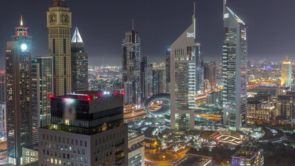 Obraz premium Skyscrapers on Sheikh Zayed Road and DIFC all night timelapse in Dubai, UAE.