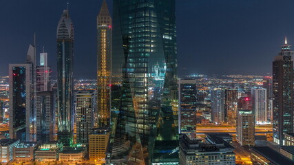 Fototapeta na wymiar Financial center of Dubai city with luxury skyscrapers night to day timelapse, Dubai, United Arab Emirates
