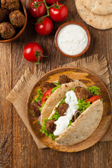Kebab, kofta in pita, bun. Traditional southern European dish. Top view.
