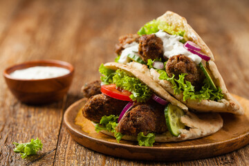 Kebab, kofta in pita, bun. Traditional southern European dish. Front view.