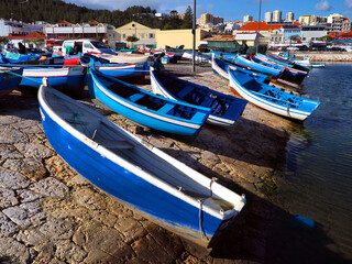 Fototapeta na wymiar Small boats on slipway ramp in coastal fishing harbour.