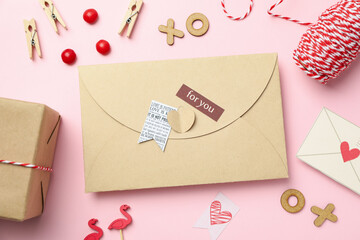 Valentine's Day accessories on pink background, top view