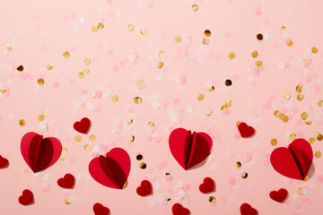 Red paper shape hearts and confetti valentine and mothers day concept