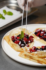 Crepes served with fresh berries and apples