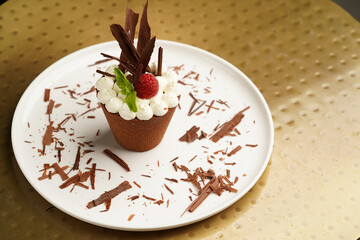 Chocolate cupcake with whipped cream and meringue