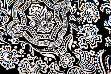 Seamless vintage abstract white floral pattern on black textiles fabric, retro background