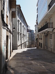 Narrow street in A Coruna city in Spain - vertical