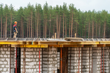 A construction site near a forest in an ecologically clean area. Construction of a country house in...