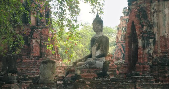 Ancient old buddha statues at Wat Mahathat ancient capital of Sukhothai Thailand. Sukhothai Historical Park is the UNESCO world heritage. Amazing Thailand travel concept.