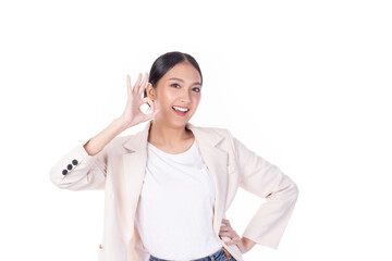 Portrait of beautiful young business Asian woman model long hair in suit smile, happy and enjoying in studio isolated on white background. The model raises her hand as an ok symbol.