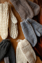 Fototapeta na wymiar knitted hand made gloves and socks made of woolen thread