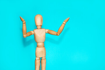 yellow wooden mannequin gesturing with his hands