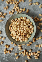 pistachio nuts on stone surface