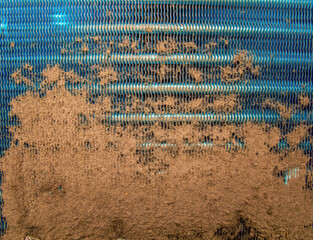 Dust-clogged aluminum radiator grill of a car. Clogged cooling system. Refrigerator repair. Cooling...