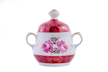 Ceramic white vintage sugar bowl with golden floral pattern isolated on white background. Copy space.
